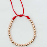 Pulsera tejida oro laminado rosa con balín #4