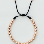 Pulsera tejida oro laminado rosa con balín #4